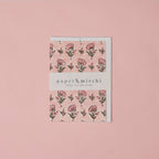 Carte fleurie – Petites fleurs sur fond rose poudré