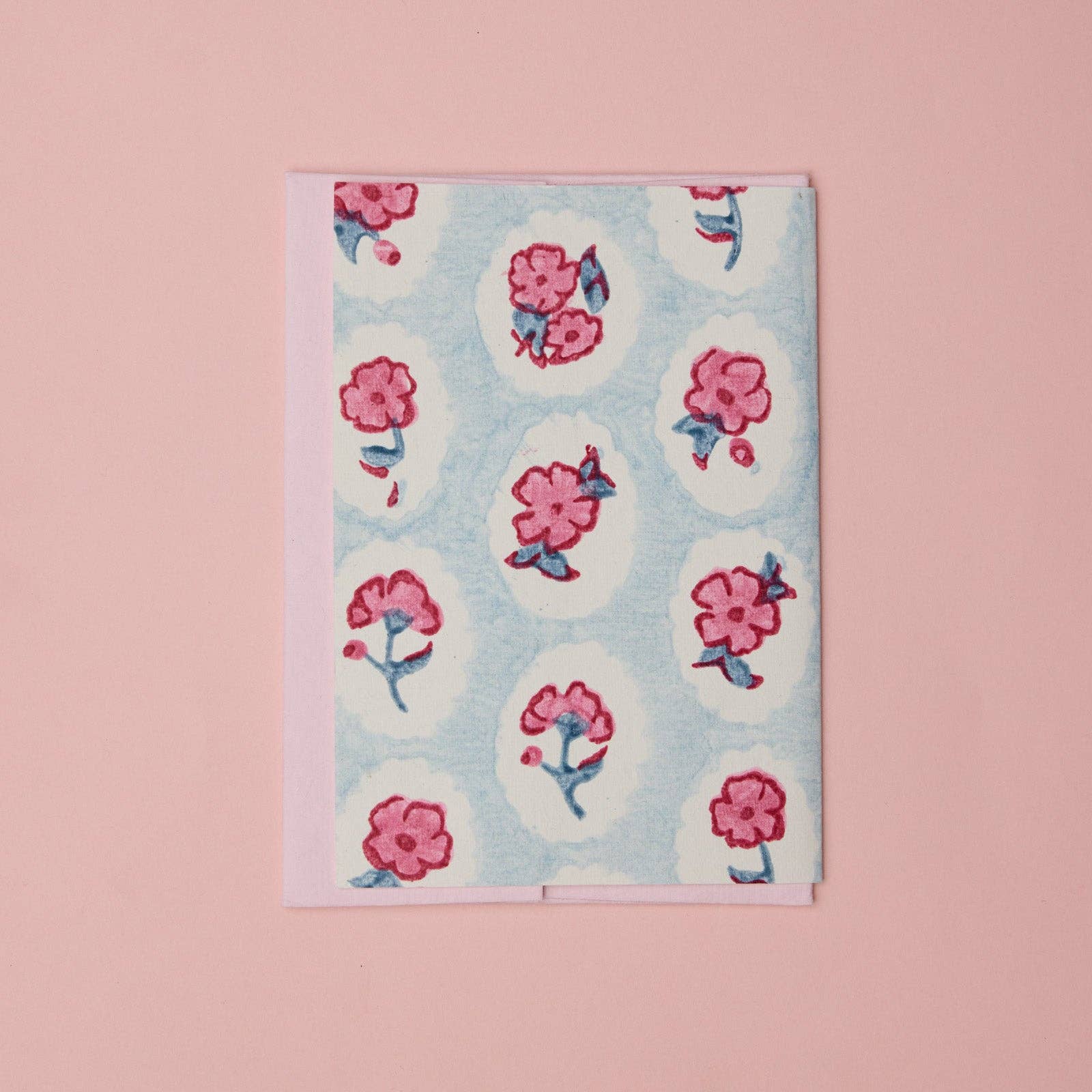 Carte fleurie – Fleurs roses sur fond bleu